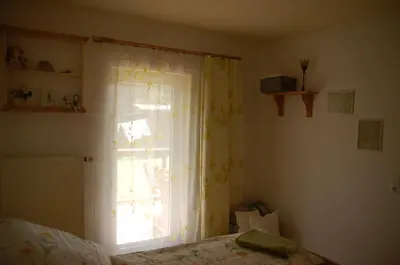 Ein Bett oder Betten in einem Zimmer der Unterkunft Ferienwohnung Katzstein