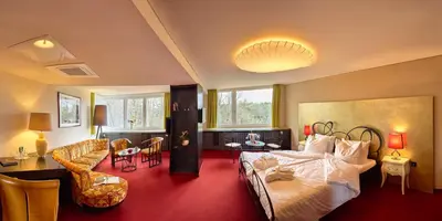 Ein Bett oder Betten in einem Zimmer der Unterkunft Berghotel Bastei