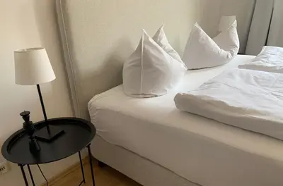 Ein Bett oder Betten in einem Zimmer der Unterkunft Ferienwohnung Geißler