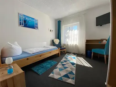 Ein Bett oder Betten in einem Zimmer der Unterkunft W.I.P. Welt im Park