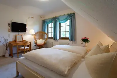 Ein Bett oder Betten in einem Zimmer der Unterkunft Hotel & Restaurant Kleinolbersdorf