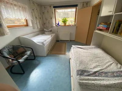 Ein Bett oder Betten in einem Zimmer der Unterkunft Holzhaus 