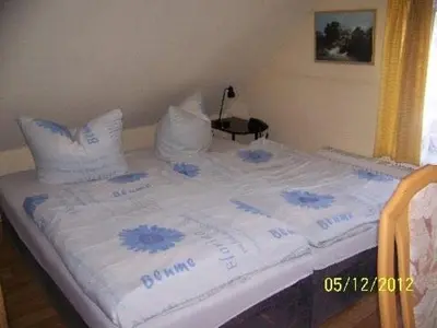 Ein Bett oder Betten in einem Zimmer der Unterkunft Pension Strohbach