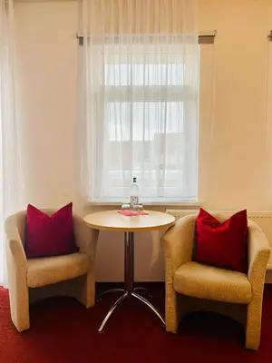 Ein Sitzbereich in der Unterkunft Pension Garni No.11
