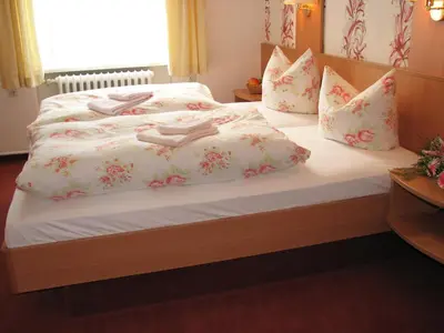 Ein Bett oder Betten in einem Zimmer der Unterkunft Pension Villa Anna