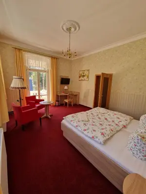 Ein Bett oder Betten in einem Zimmer der Unterkunft Pension Villa Anna