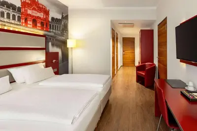 Ein Bett oder Betten in einem Zimmer der Unterkunft Amedia Plaza Dresden, Trademark Collection by Wyndham