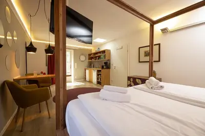 Ein Bett oder Betten in einem Zimmer der Unterkunft Little Suite Apartments
