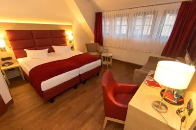 Ein Bett oder Betten in einem Zimmer der Unterkunft Hotel Kreller