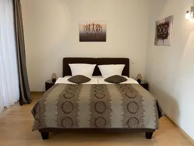 Ein Bett oder Betten in einem Zimmer der Unterkunft FeWo am Zwinger 2