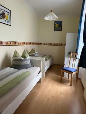 Ein Bett oder Betten in einem Zimmer der Unterkunft Ambiente an der Elbe, Wohnung EG