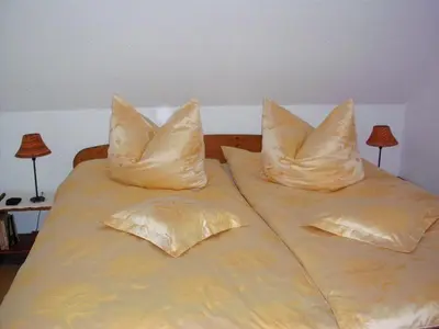 Ein Bett oder Betten in einem Zimmer der Unterkunft Ferienwohnung Mund