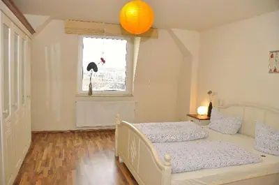 Ein Bett oder Betten in einem Zimmer der Unterkunft 4R Fewo Altstadtblick -L15