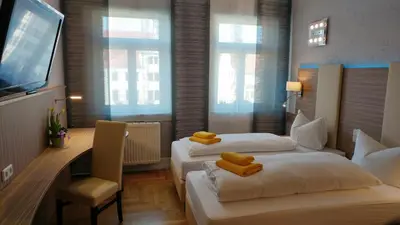 Ein Bett oder Betten in einem Zimmer der Unterkunft Hotel Goldener Anker