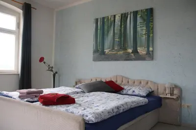 Ein Bett oder Betten in einem Zimmer der Unterkunft Zum Alten König