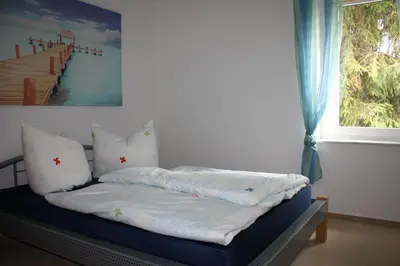 Ein Bett oder Betten in einem Zimmer der Unterkunft FeWo Strohbach