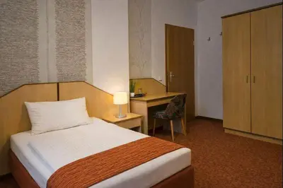 Ein Bett oder Betten in einem Zimmer der Unterkunft Richzenhainer-Hof