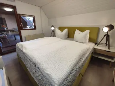 Ein Bett oder Betten in einem Zimmer der Unterkunft Trobischhof