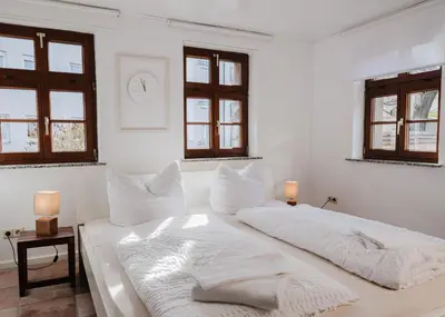Ein Bett oder Betten in einem Zimmer der Unterkunft Trobischhof