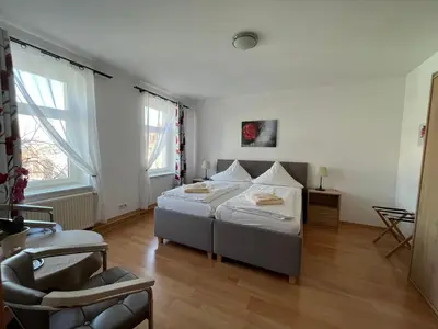 Ein Bett oder Betten in einem Zimmer der Unterkunft Pension Am Renner