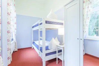 Ein Bett oder Betten in einem Zimmer der Unterkunft Parkhotel Muldental