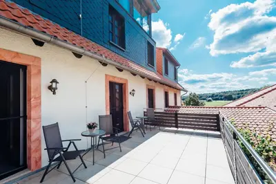 Ein Balkon oder eine Terrasse in der Unterkunft Erlebnishotel 