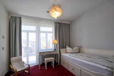 Ein Bett oder Betten in einem Zimmer der Unterkunft Dampfschiffhotel