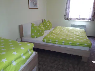 Ein Bett oder Betten in einem Zimmer der Unterkunft Ferienhaus Lilienstein