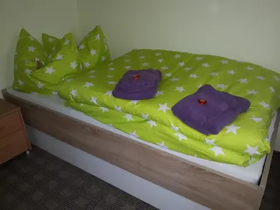 Ein Bett oder Betten in einem Zimmer der Unterkunft Ferienhaus Lilienstein