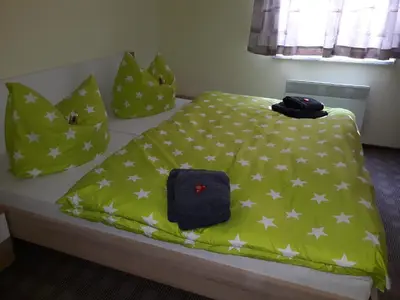 Ein Bett oder Betten in einem Zimmer der Unterkunft Ferienhaus Lilienstein