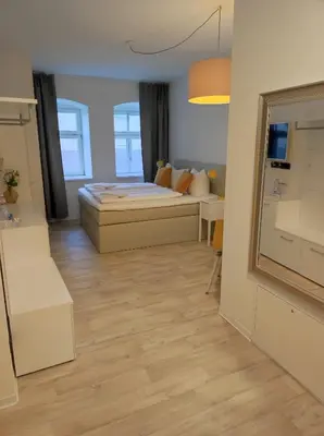 Ein Bett oder Betten in einem Zimmer der Unterkunft Hotel Blaue Blume