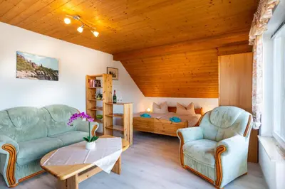 Ein Sitzbereich in der Unterkunft Pension Am Weinberg Sächsische Schweiz