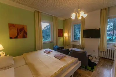 Ein Bett oder Betten in einem Zimmer der Unterkunft Pension Menge