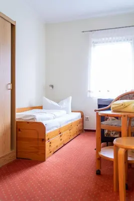 Ein Bett oder Betten in einem Zimmer der Unterkunft Landhotel Biberburg