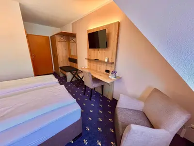 Ein Bett oder Betten in einem Zimmer der Unterkunft Hotel Gasthof zur Heinzebank
