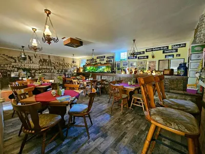 Ein Restaurant oder anderes Speiselokal in der Unterkunft Pension Zur Kutscherstube