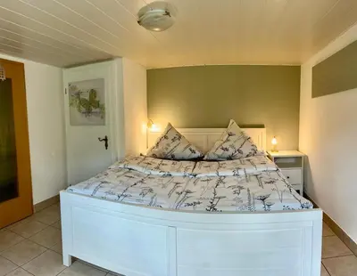 Ein Bett oder Betten in einem Zimmer der Unterkunft Michel's Ferienwohnung