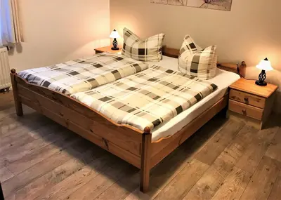 Ein Bett oder Betten in einem Zimmer der Unterkunft Haus Daheim