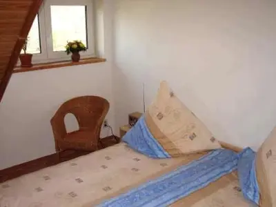 Ein Bett oder Betten in einem Zimmer der Unterkunft Ferienwohnung im DG, Parkplatz vorm Haus, WLAN