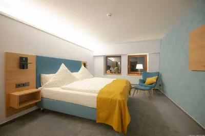 Ein Bett oder Betten in einem Zimmer der Unterkunft Landhotel Zur Guten Einkehr