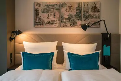 Ein Bett oder Betten in einem Zimmer der Unterkunft Motel One Dresden - Palaisplatz