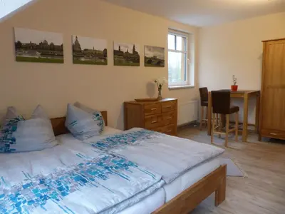 Ein Bett oder Betten in einem Zimmer der Unterkunft Ferienwohnung Ortrand - Pension
