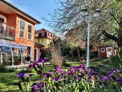 Ein Garten an der Unterkunft Zentrumsnahe Ferienwohnung
