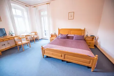 Ein Bett oder Betten in einem Zimmer der Unterkunft Bilz-Pension