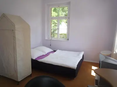 Ein Bett oder Betten in einem Zimmer der Unterkunft Postamt Lauenstein