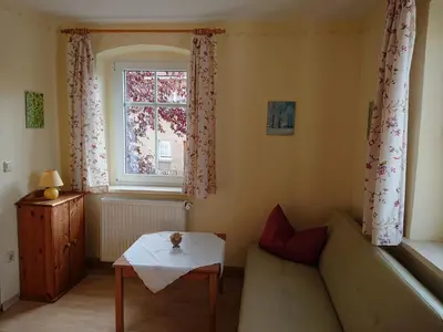 Ein Sitzbereich in der Unterkunft Alte Käserei Kössern