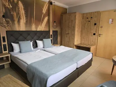 Ein Bett oder Betten in einem Zimmer der Unterkunft Hotel 