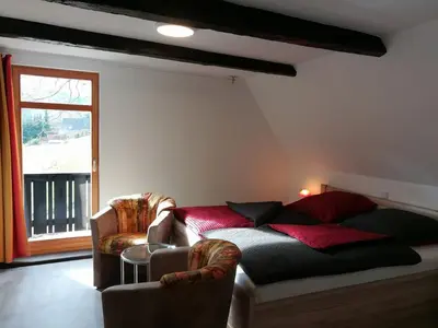 Ein Bett oder Betten in einem Zimmer der Unterkunft Die Oberlochmühle PENSION