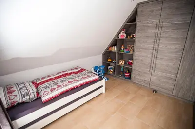Ein Bett oder Betten in einem Zimmer der Unterkunft Weinberghaus Prossen, Haus mit Sauna und Whirlpool für maximal 8 Personen