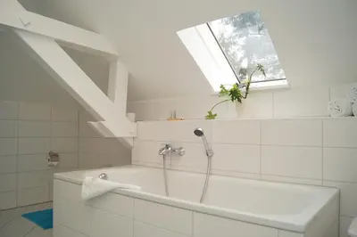 Ein Badezimmer in der Unterkunft Aparthotel Villa Freisleben